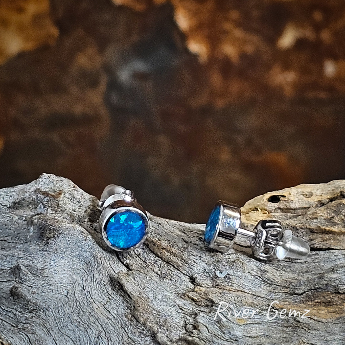 Front and side view of Crystal opal earrings showing the butterfly backing and silicon stopper.