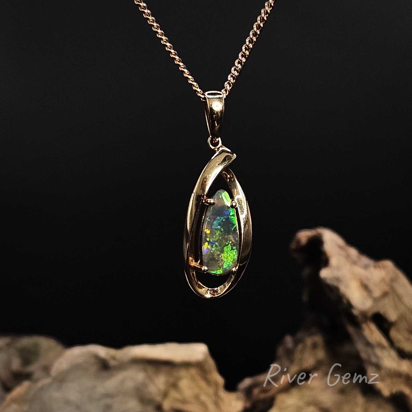 Opal pendant necklace on a dark background with 'River Gemz' branding.