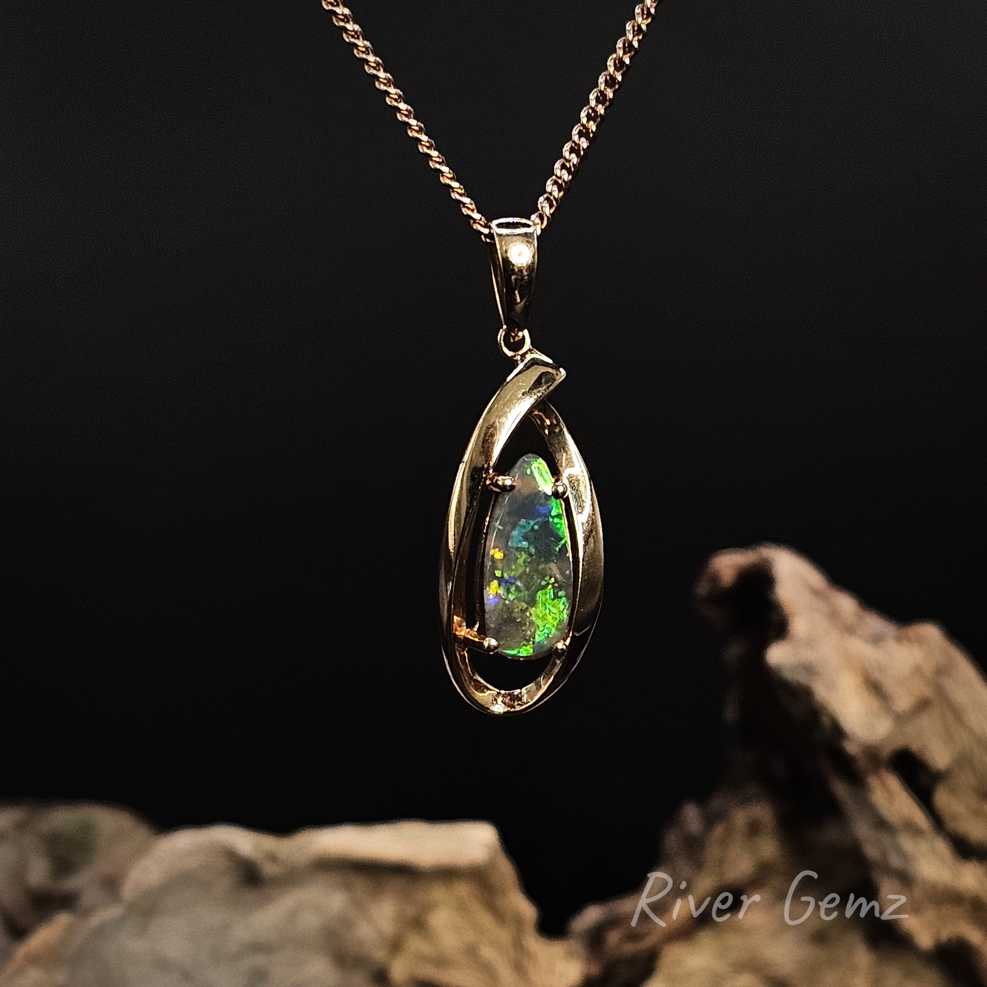 Opal pendant necklace on a dark background with 'River Gemz' branding.