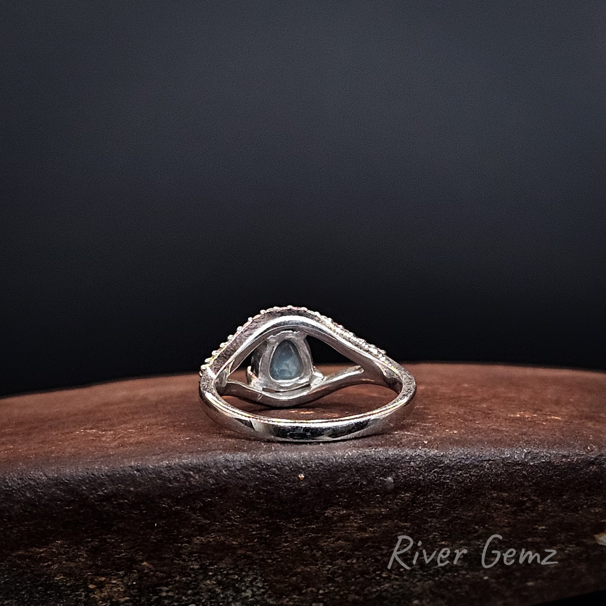Rear view of the ring shows the dark base tone of the semi-black opal included.