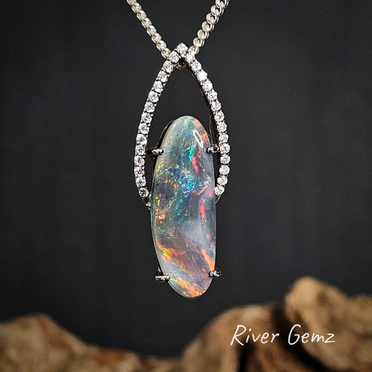 Opal and white diamonds pendant necklace with 'River Gemz' branding on a dark background
