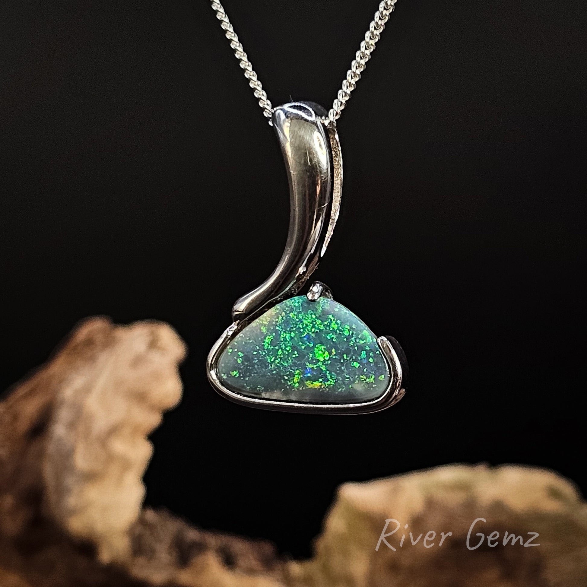 Opal pendant necklace on a dark background with 'River Gemz' branding.