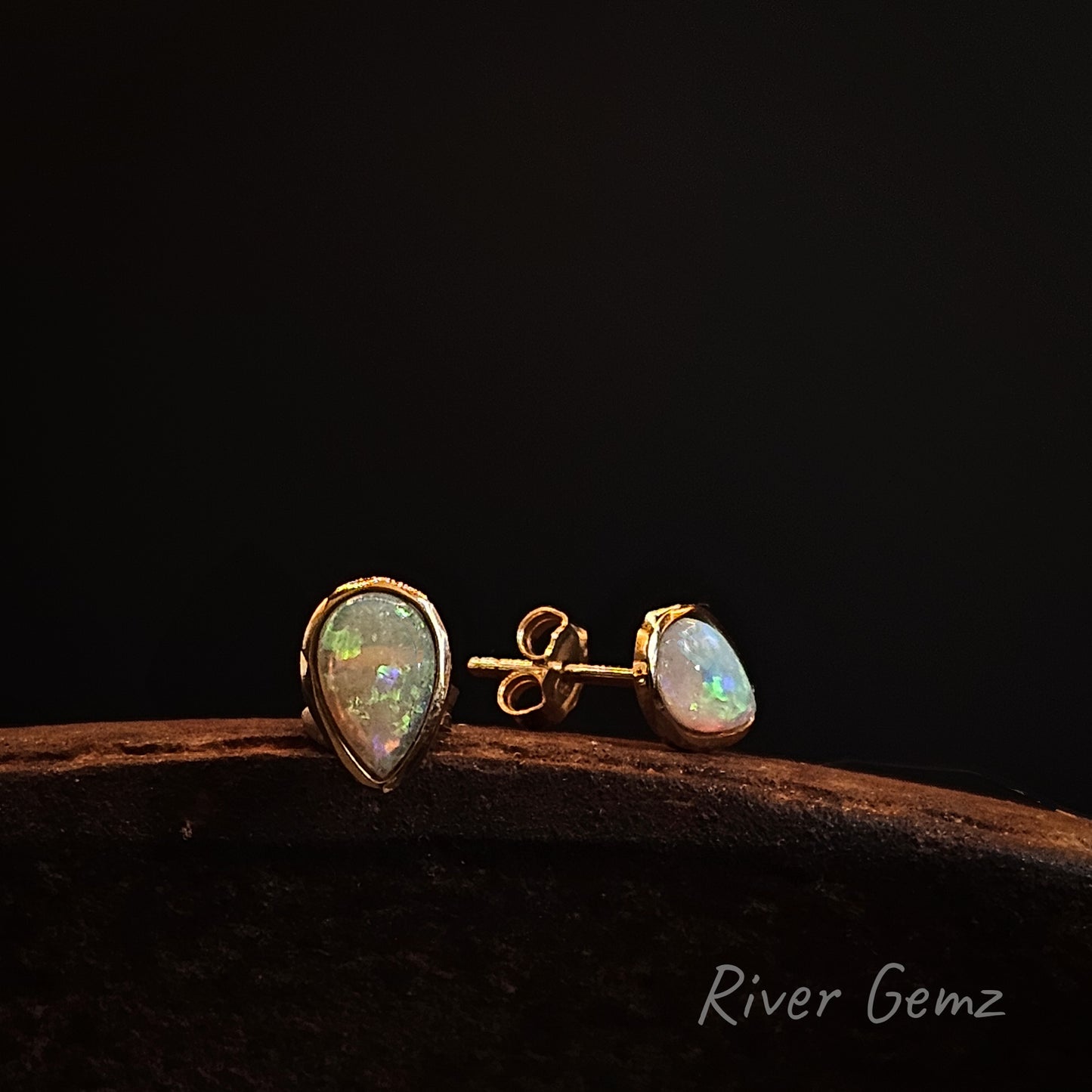 Opal earrings on a dark background with 'River Gemz' branding.