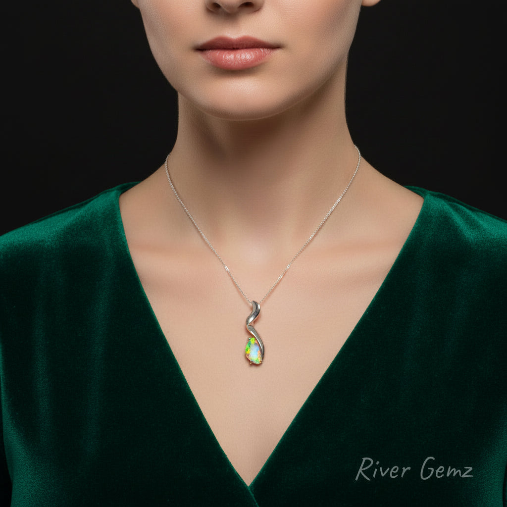 Silver opal pendant shown being worn by a woman.