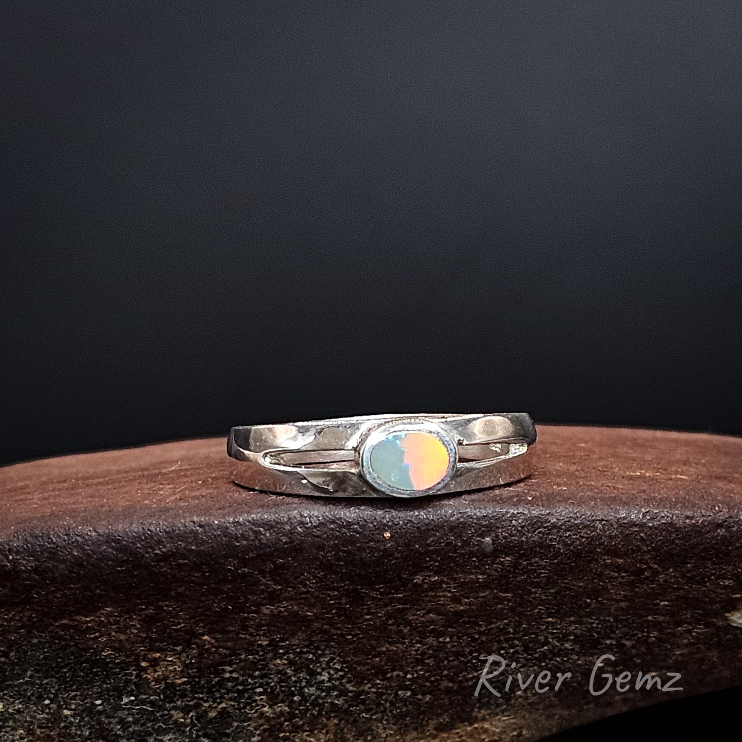 Bright orange and green opal set in sterling silver ring.