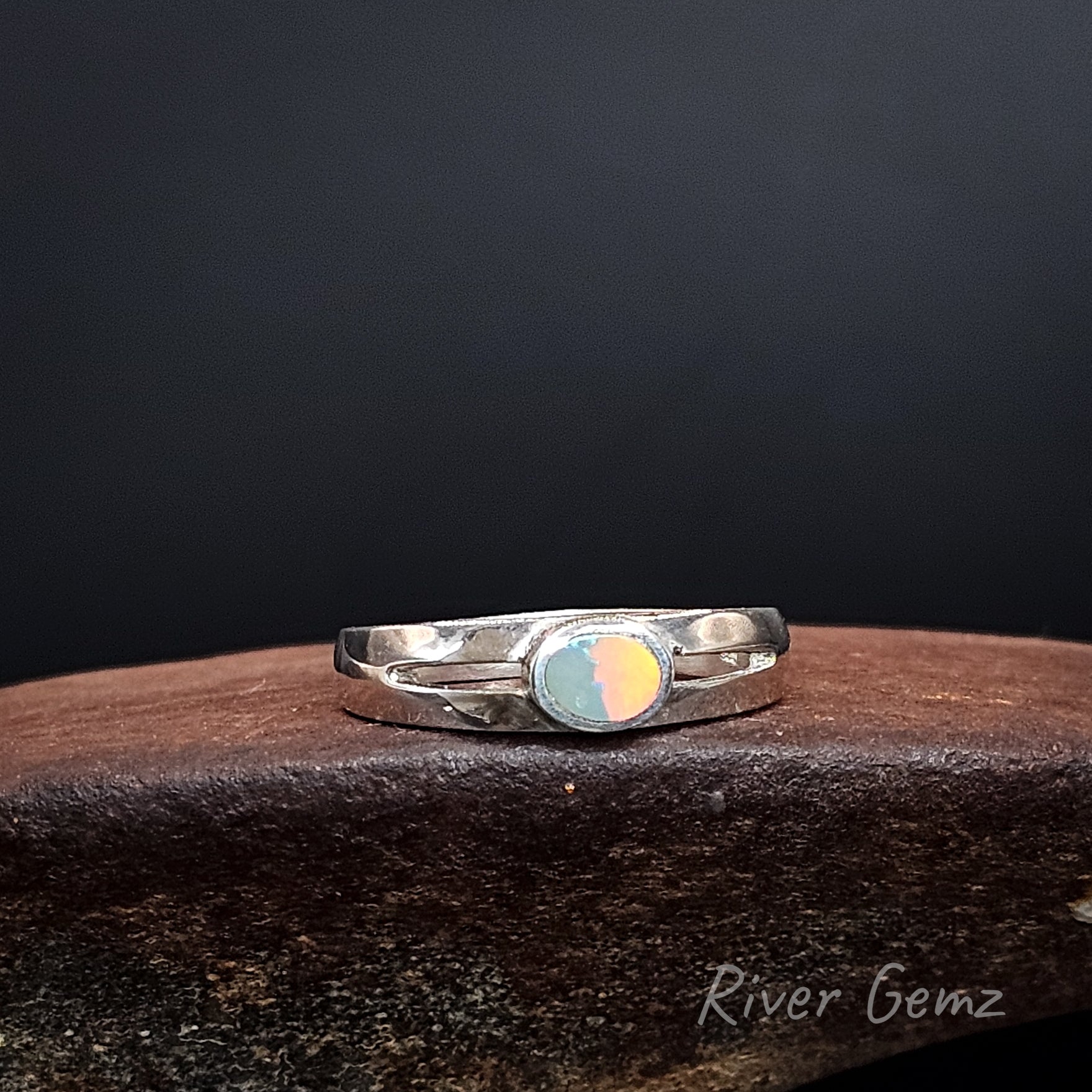 Bright orange and green opal set in sterling silver ring.