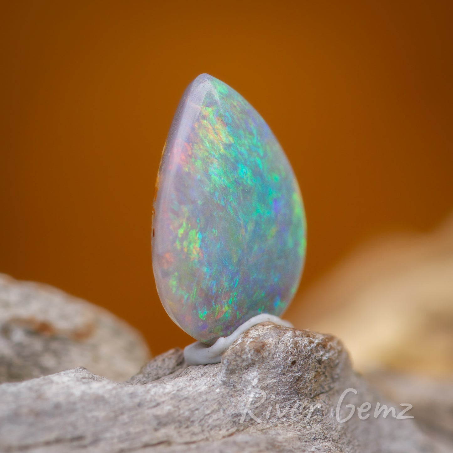 Slightly side on view showing the left hand edge of the solid unset opal.