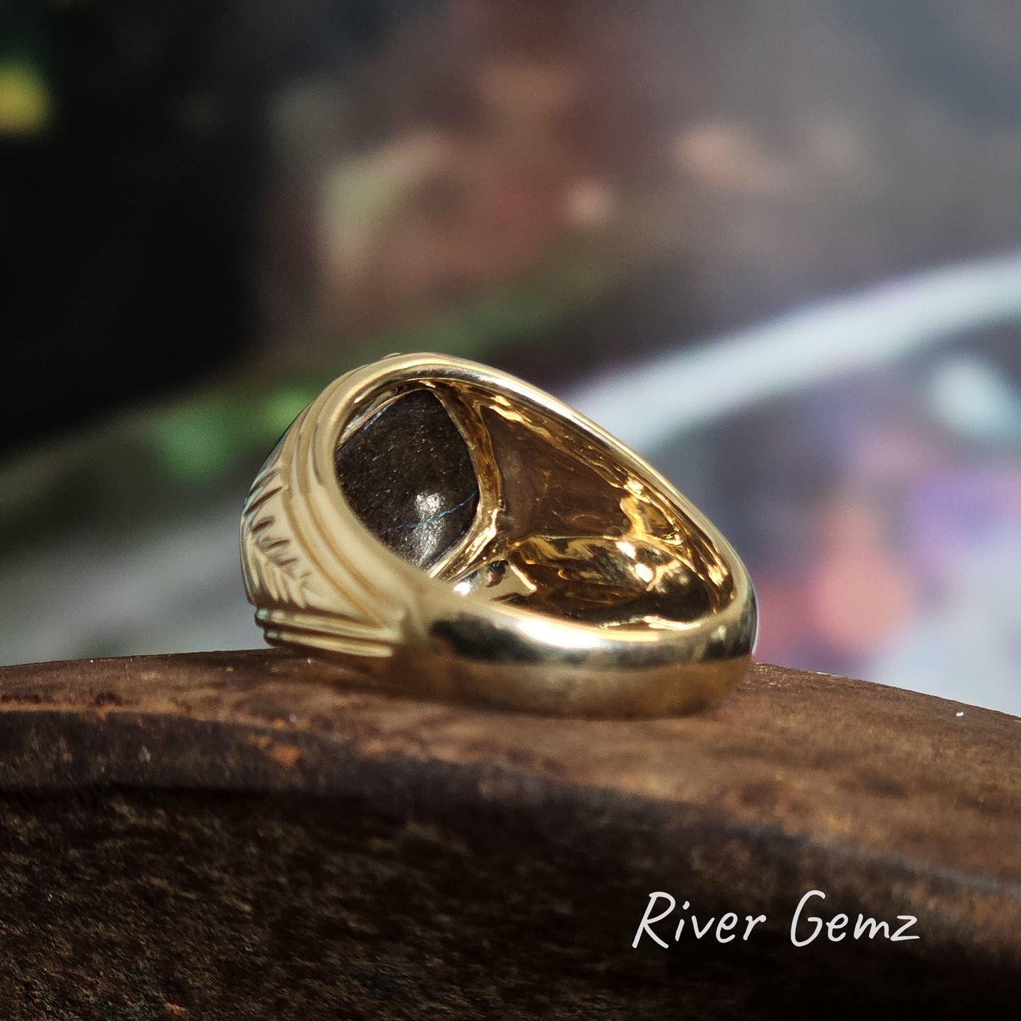 Rear view of the gold ring shows the ironstone host of the solid boulder opal.