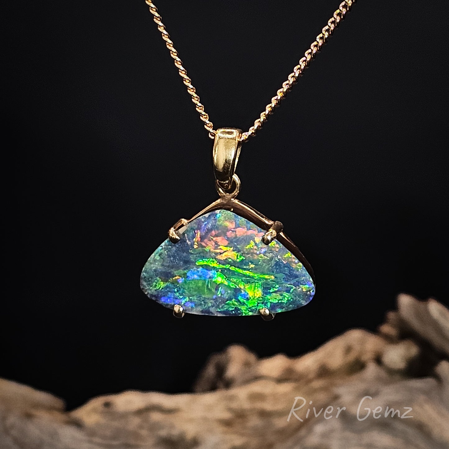 Opal pendant necklace on a dark background with 'River Gemz' branding.