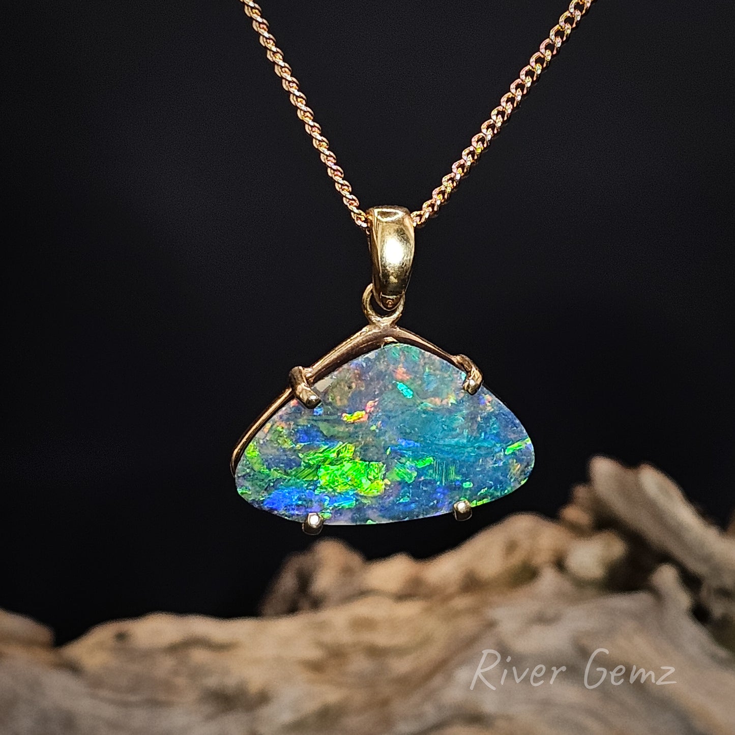 Opal pendant necklace on a dark background with 'River Gemz' branding.