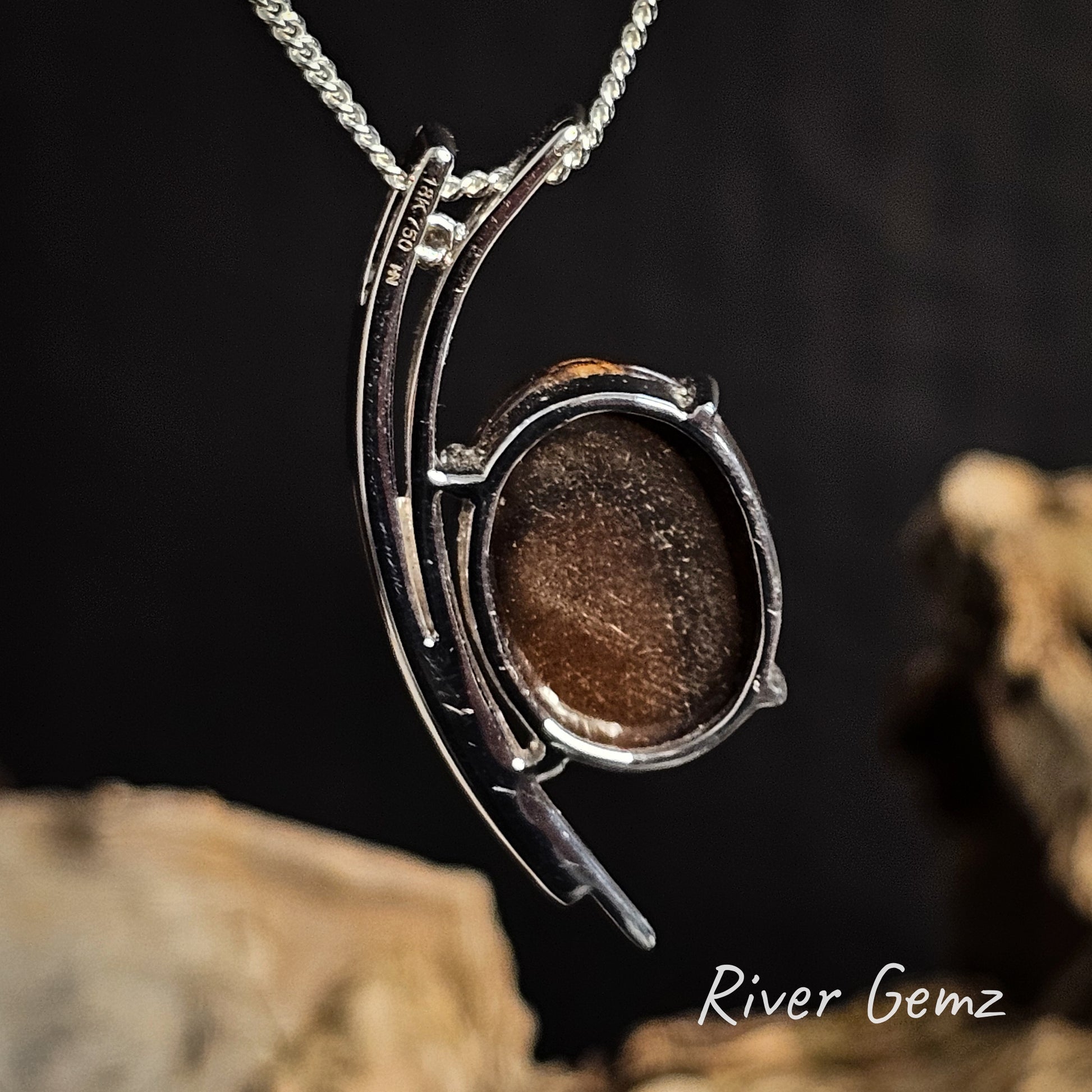 Rear of pendant showing the ironstone matrix of the boulder opal on a dark background, featuring 'River Gemz' branding.