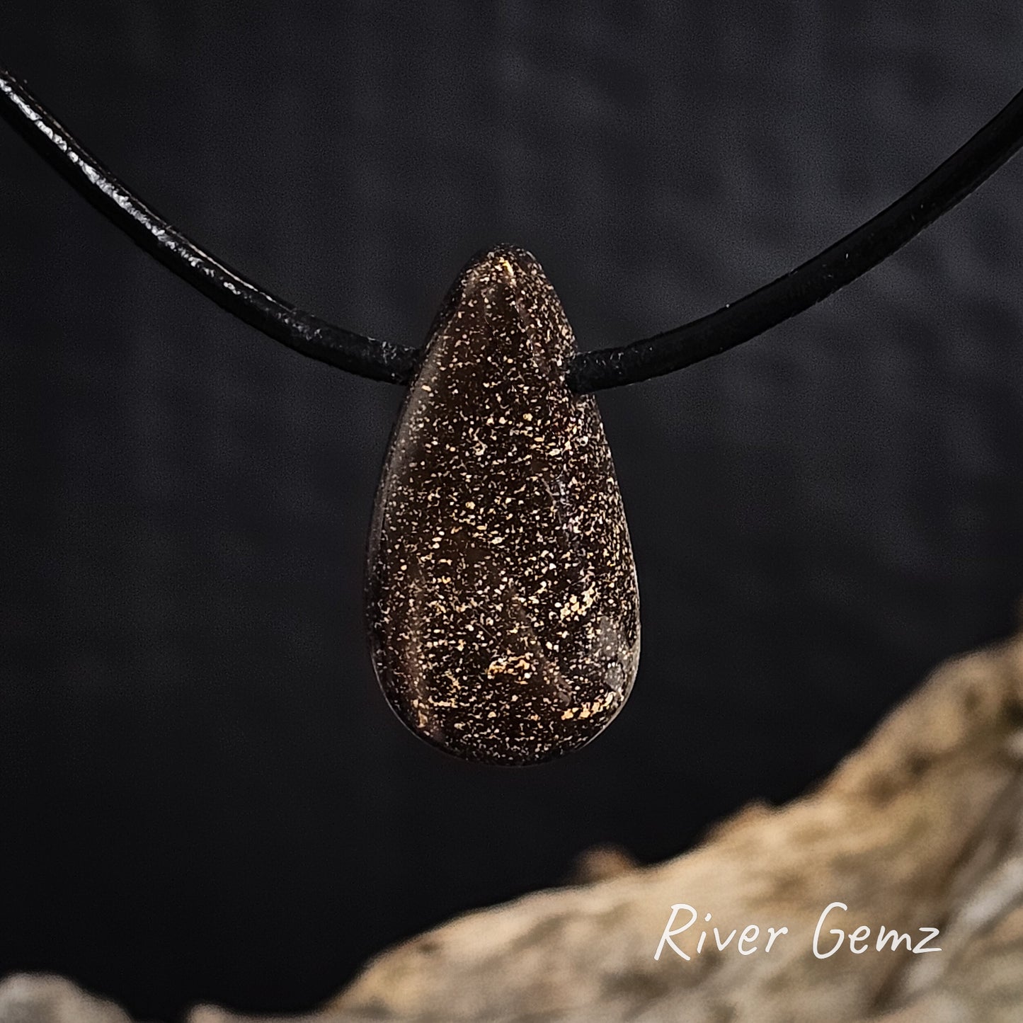 Rear view of the stone shows the ironstone matrix base of the boulder opal.