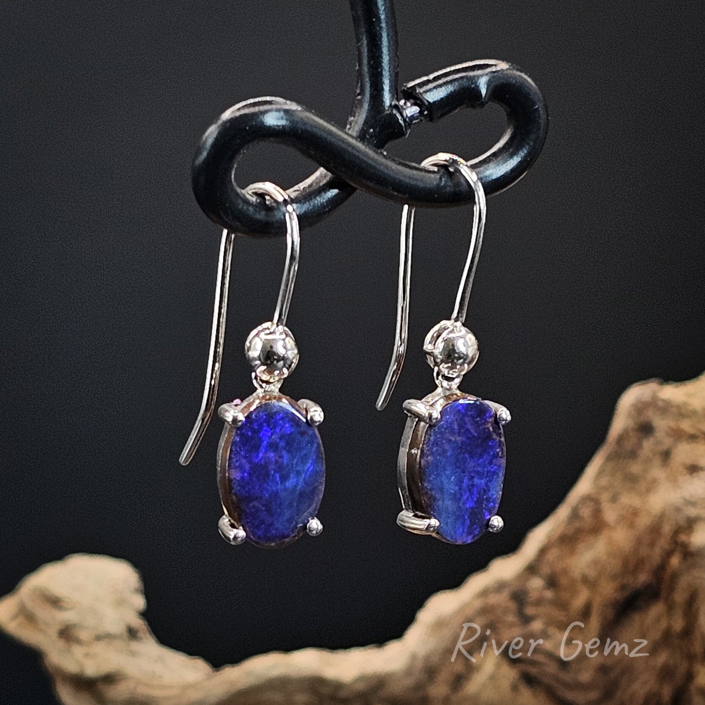 Purple and blue boulder opals in sterling silver French hooks.