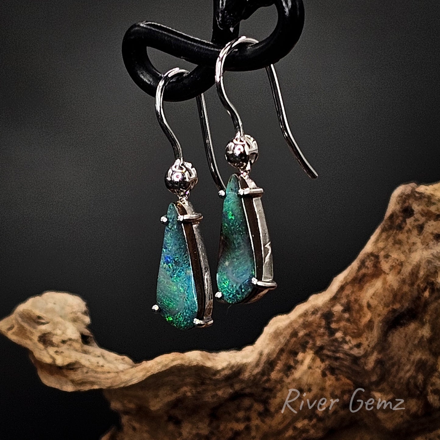 Sterling silver French hook earrings shown on a dark background with River Gemz branding.