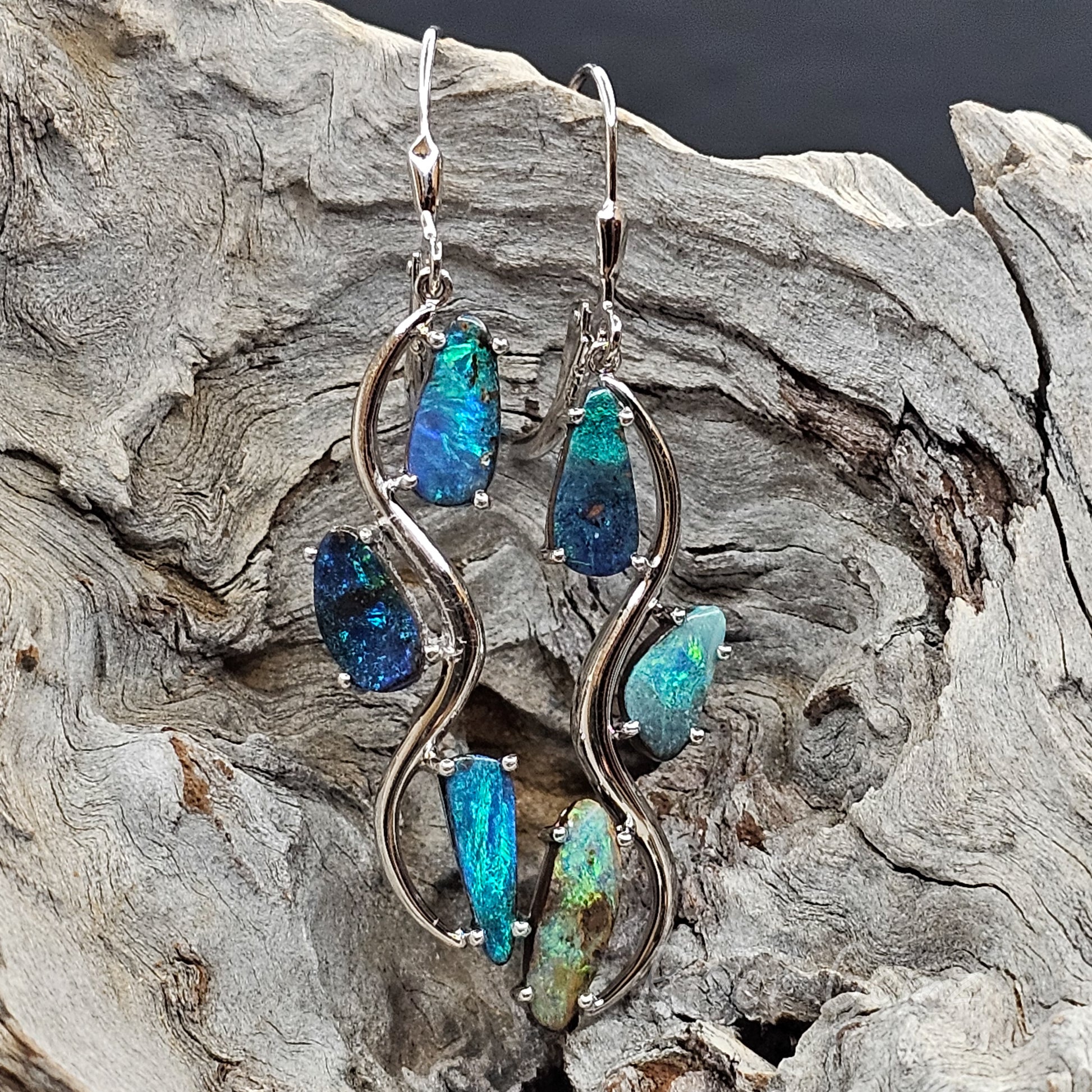 Vivid ocean colours abound in the 3 boulder opals in each of the sterling silver shepherd hook earrings.