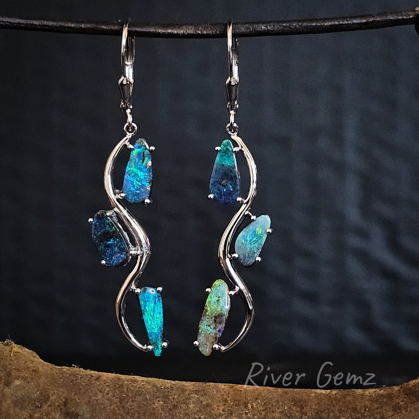 Three blue and green opals in each drop sterling silver drop earring.