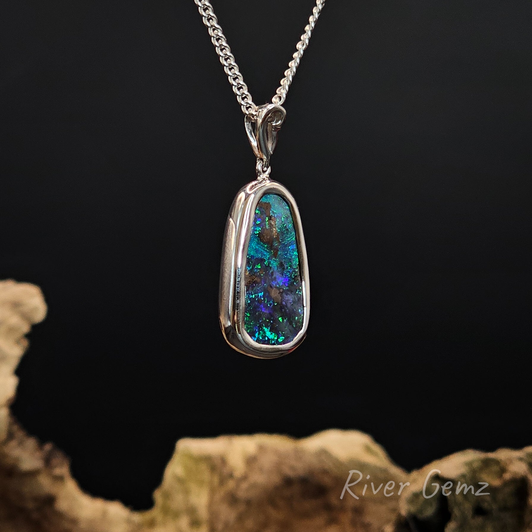 Opal pendant necklace on a dark background with 'River Gemz' branding.
