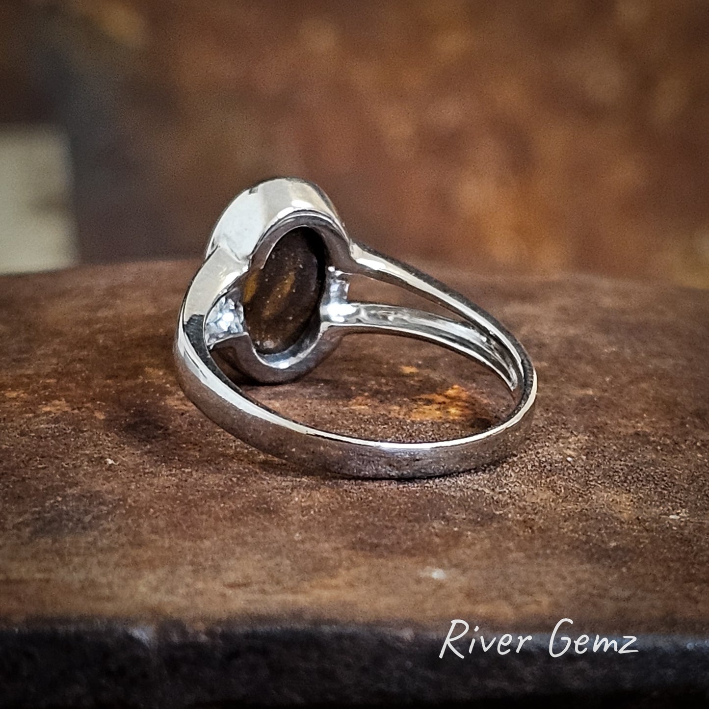 Back view of ring shows the ironstone host stone of the boulder opal.