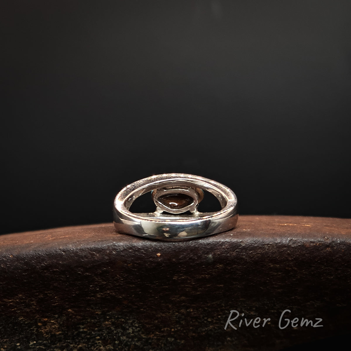 Rear view of the silver ring shows the ironstone matrix of the boulder opal set in it. The brand name 'River Gemz' is visible in the bottom right corner.