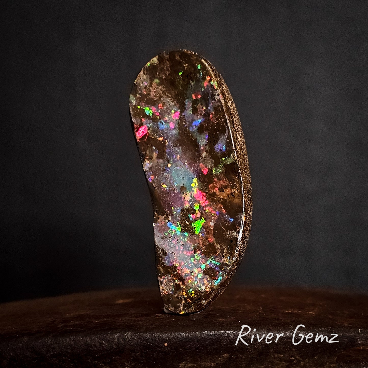 All colours of the rainbow shown in the large boulder opal.