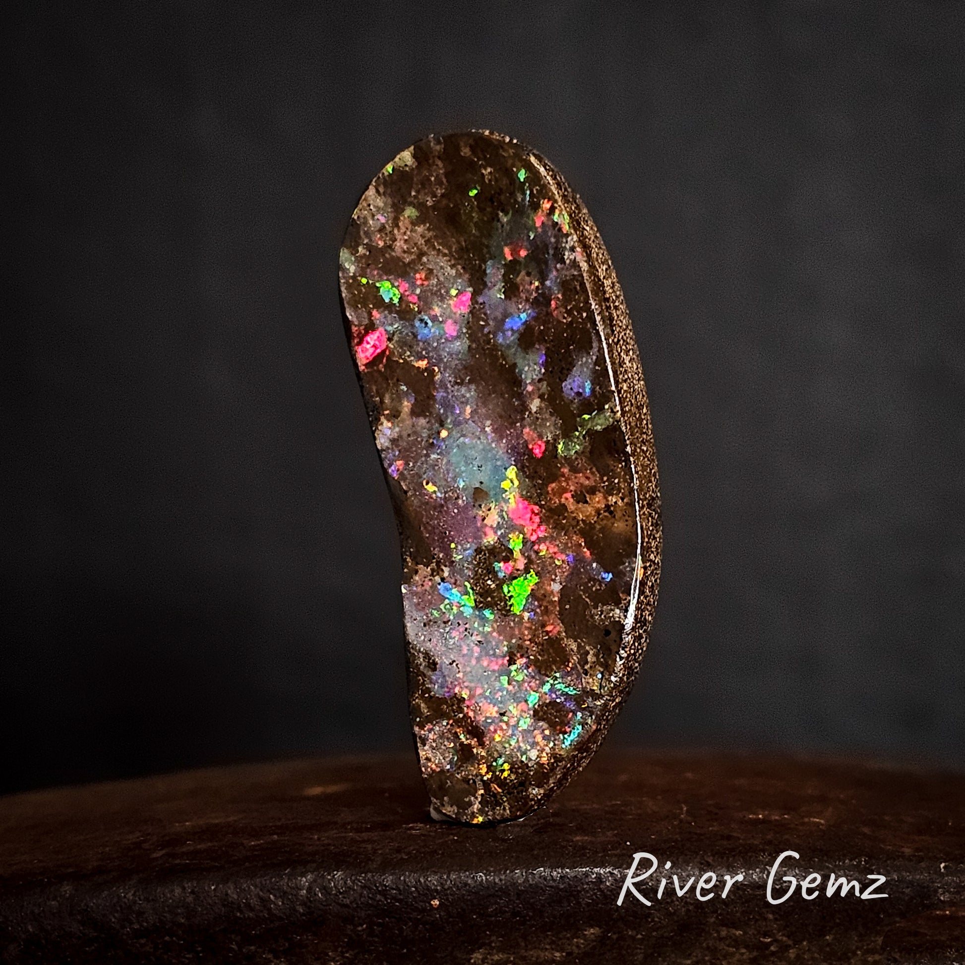 All colours of the rainbow shown in the large boulder opal.