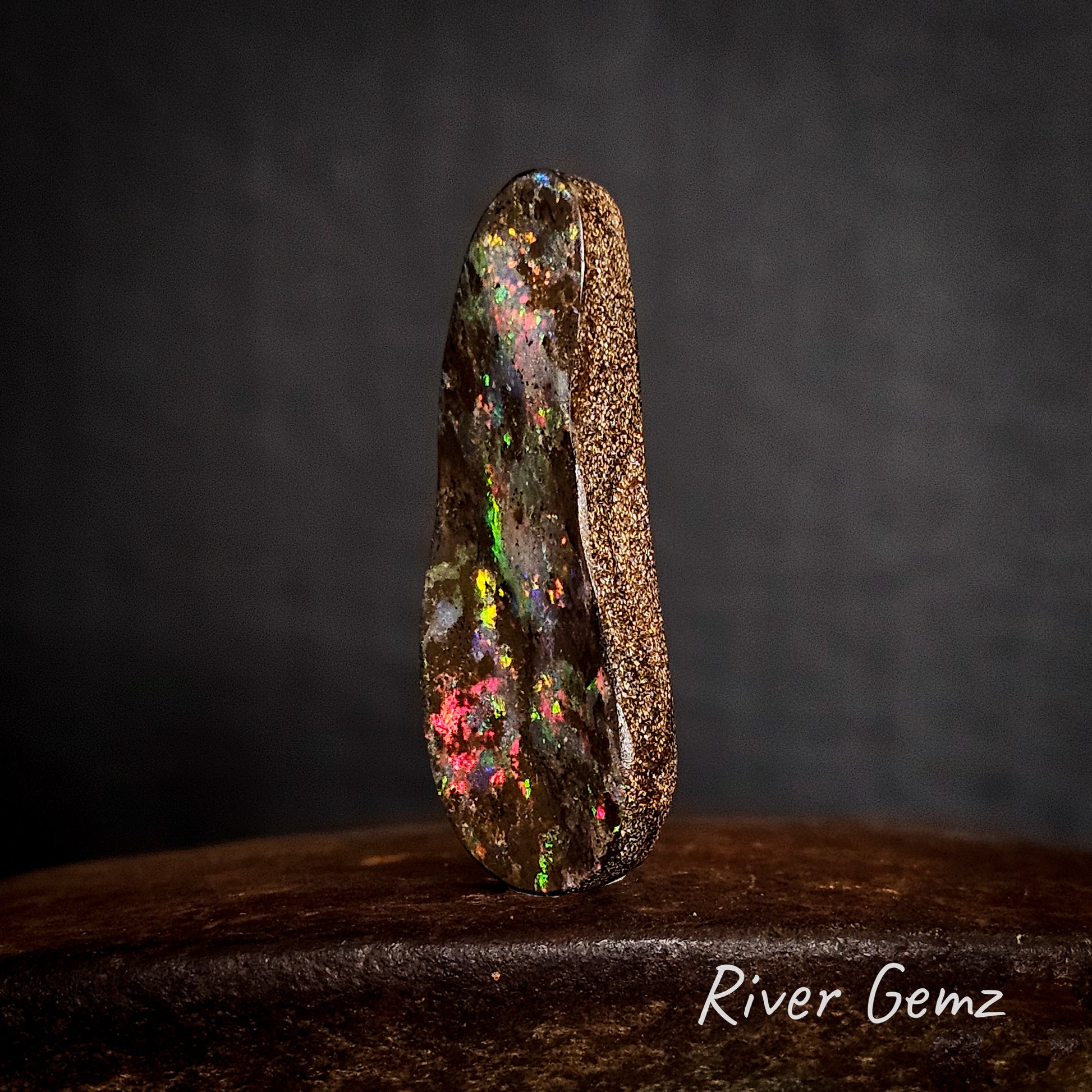 Side view of upright boulder opal showing the thickness of the solid opal.