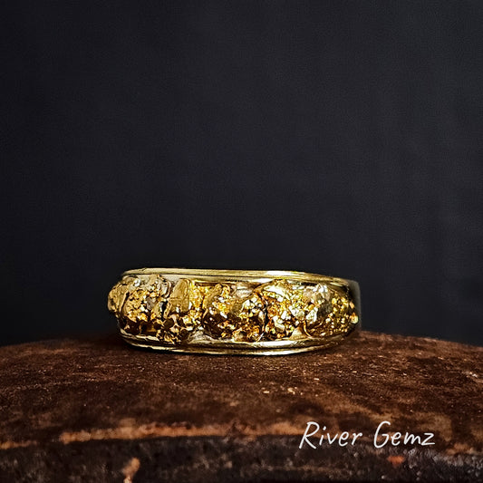 Gold ring with natural nuggets on a dark background, featuring 'River Gemz' branding.