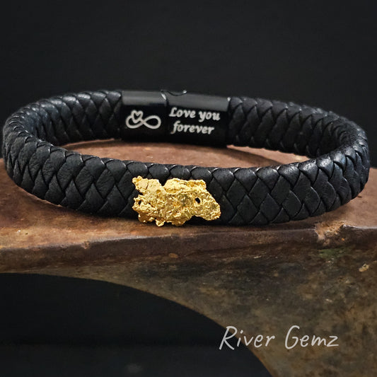 Wide black leather bracelet with a large natural gold nugget. A message "Love you forever" and represented symbolically printed on the back of the lock.