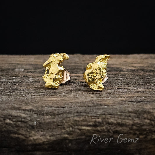 Front view of  bright yellow natural nuggets in each stud earring.