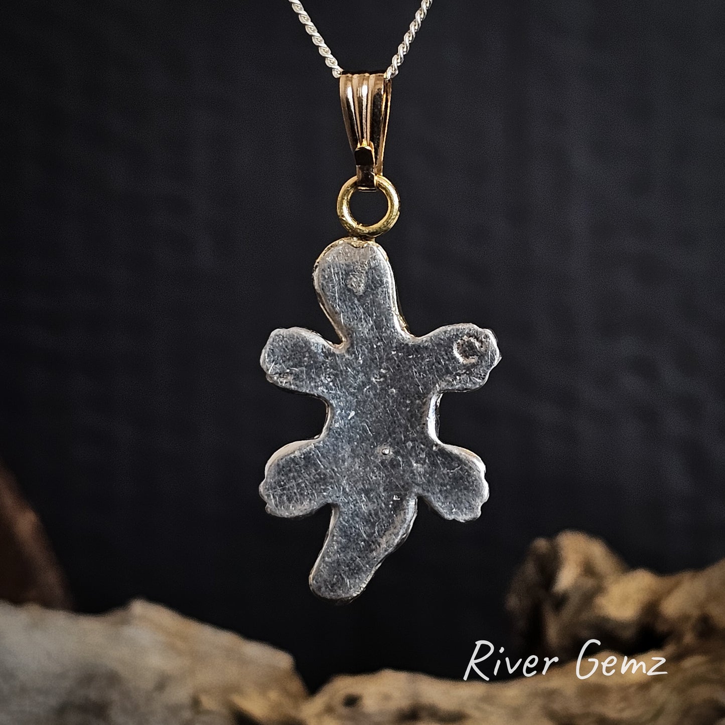 Rear of pendant shows platypus is solid silver.