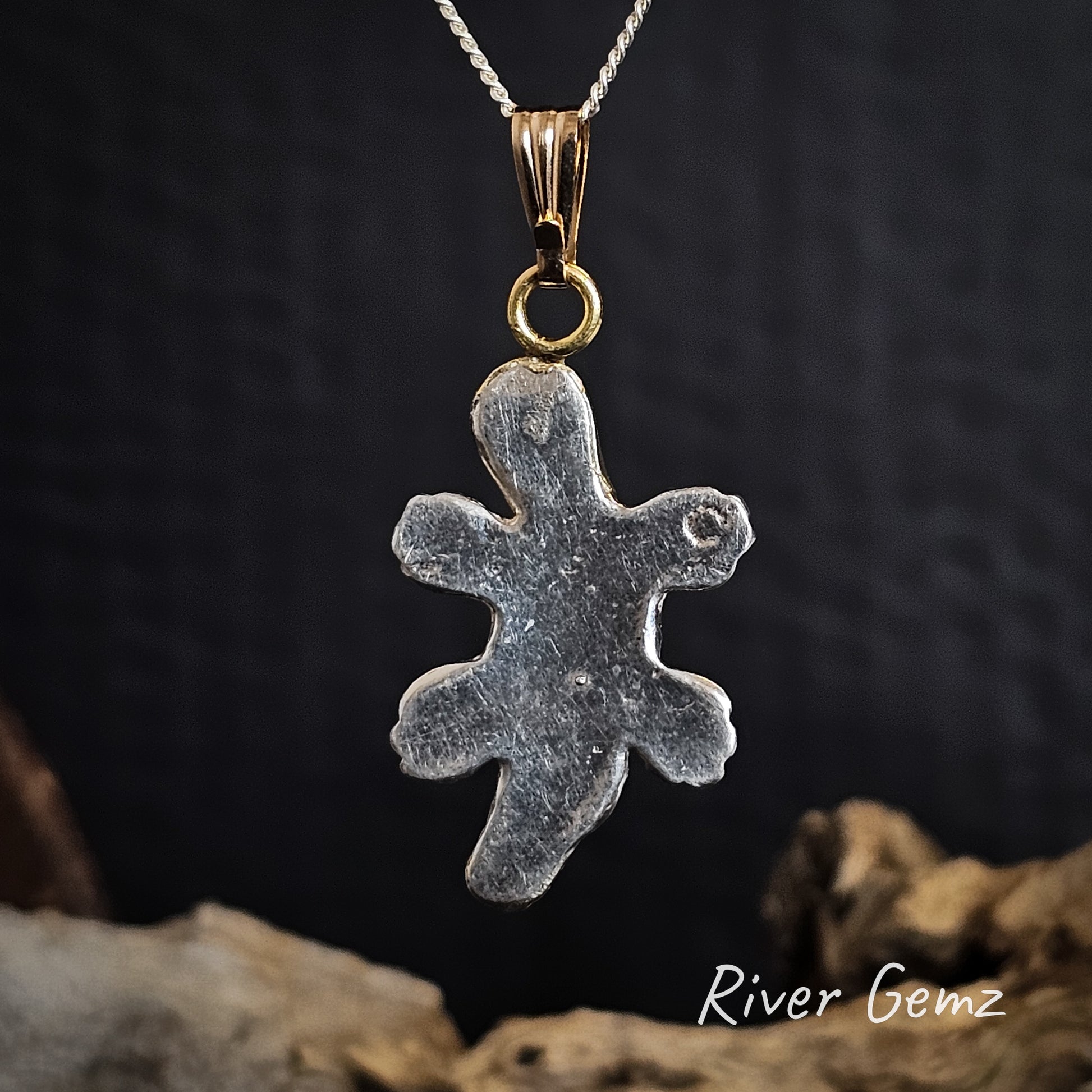 Rear of pendant shows platypus is solid silver.