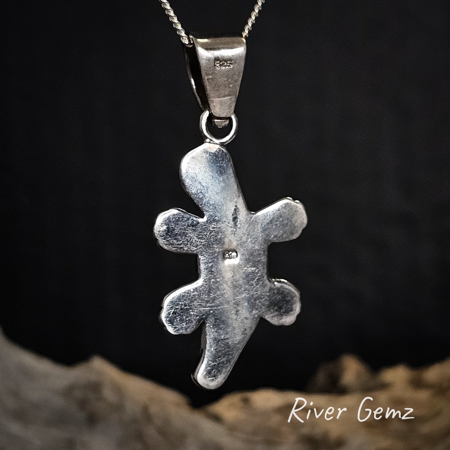 Rear view of platypus pendant showing the 925 silver stamp on a chain against a dark background with 'River Gemz' branding.