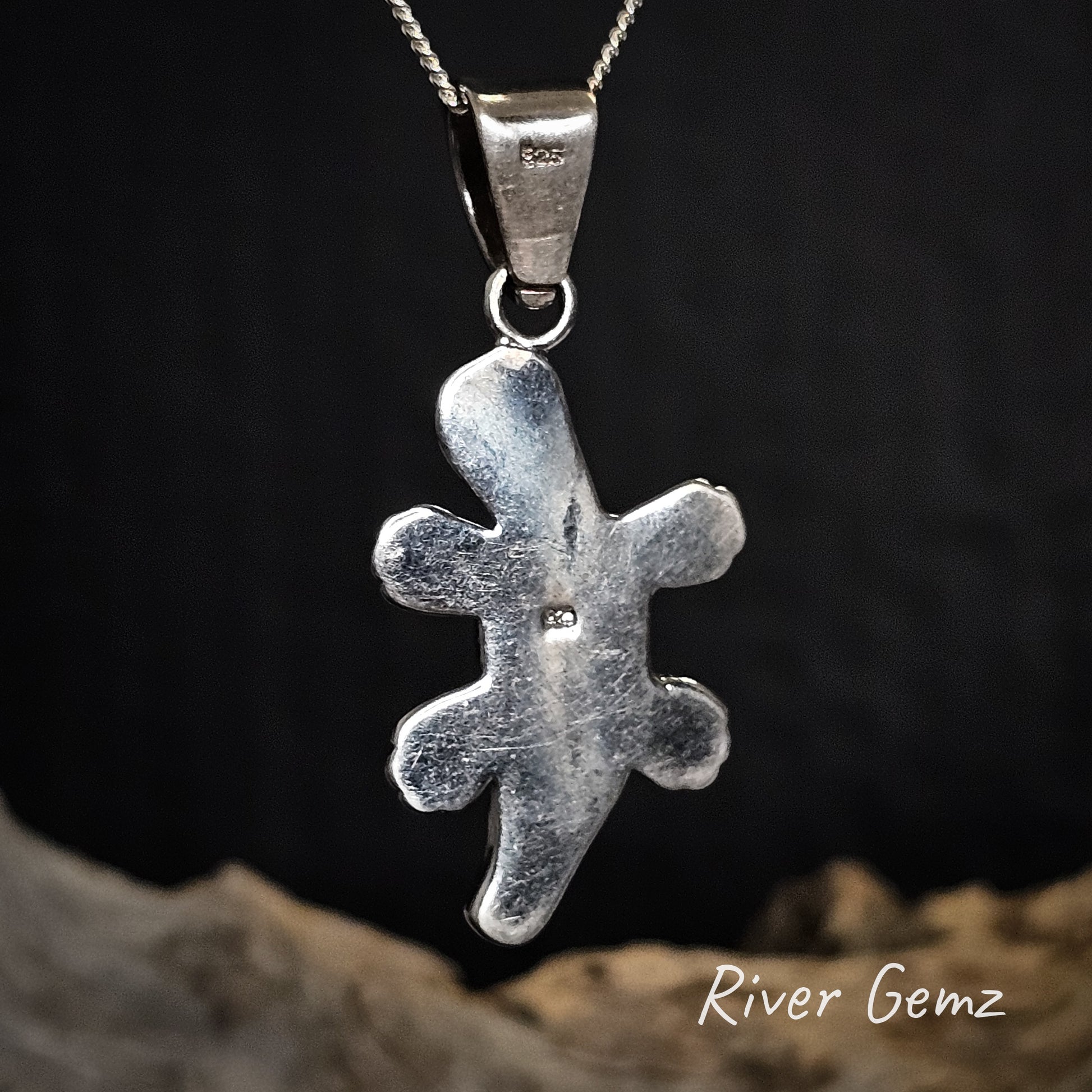 Rear view of platypus pendant showing the 925 silver stamp on a chain against a dark background with 'River Gemz' branding.
