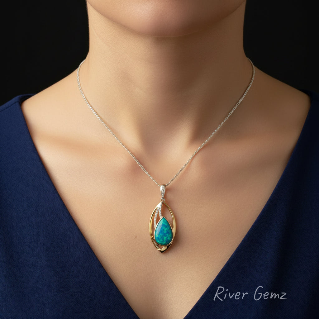 Opal pendant necklace with gold and silver design on a woman's neck on a black background, branded 'River Gemz'.
