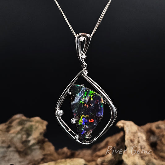 Opal pendant necklace on a dark background with 'River Gemz' branding.