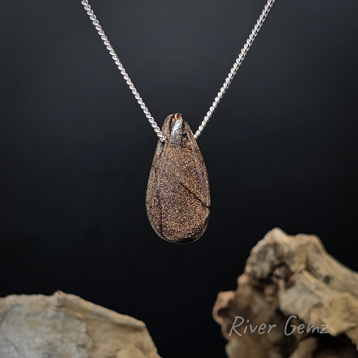 Rear view of the necklace shows the brown base tone of the boulder opal.