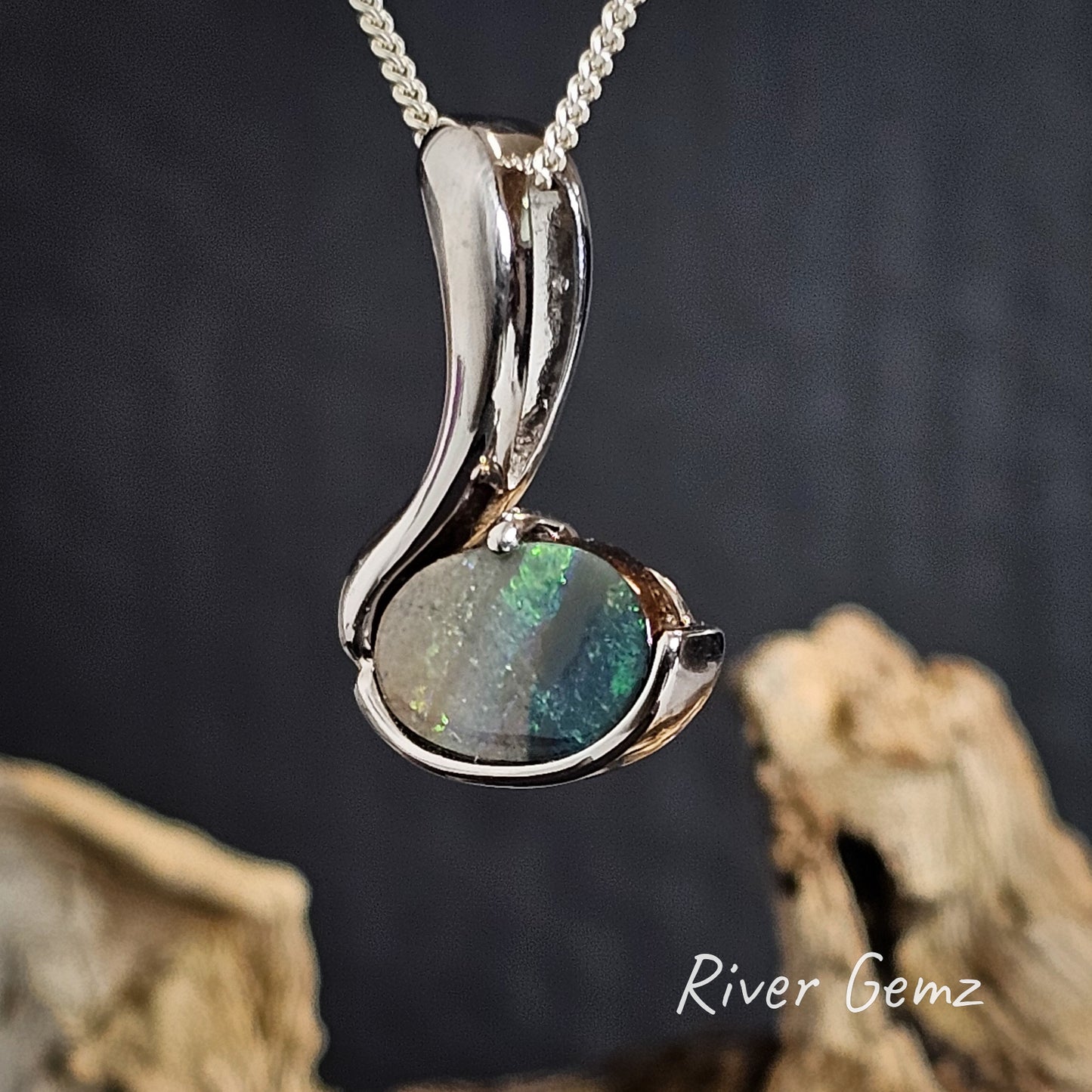 Striped green and grey boulder opal set in sterling silver necklace.