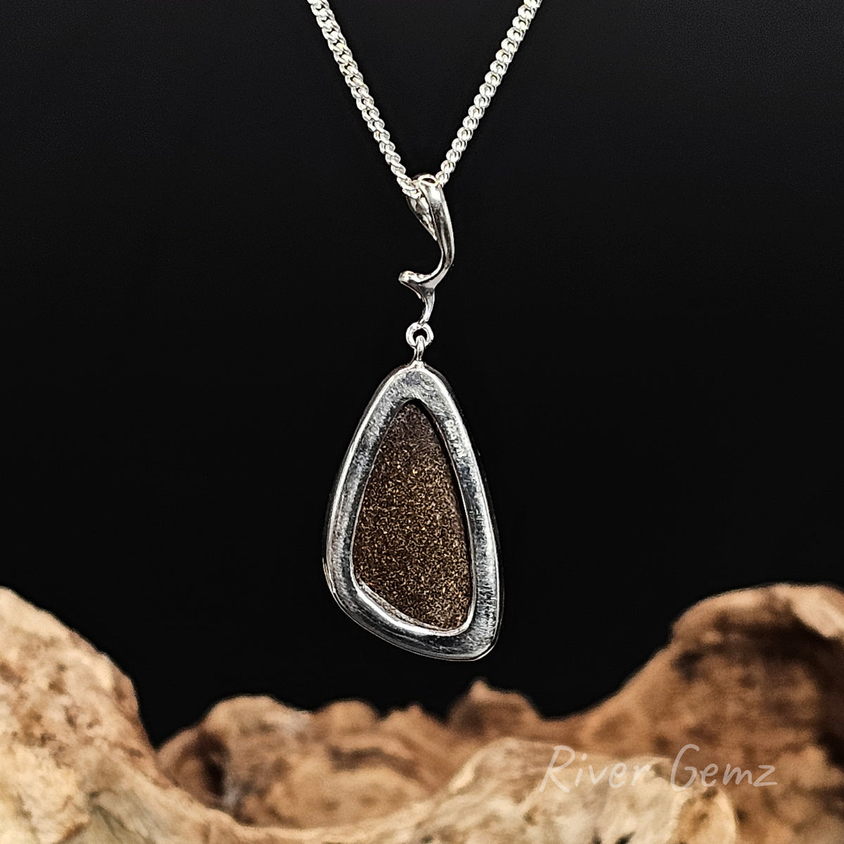 Rear view of the necklace shows the ironstone matrix of the inserted boulder opal.