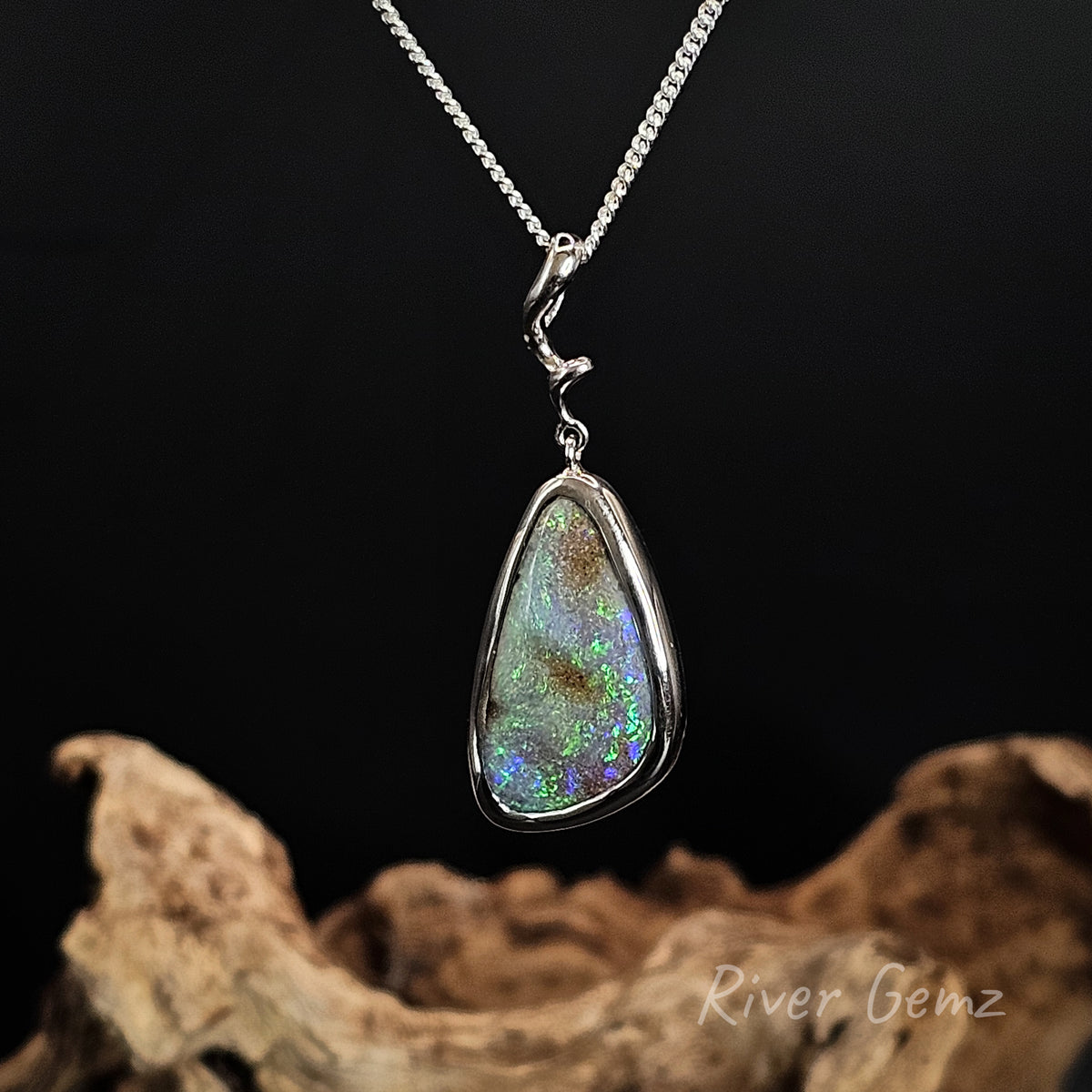 Blue and green opal besel set in modern design silver necklace.