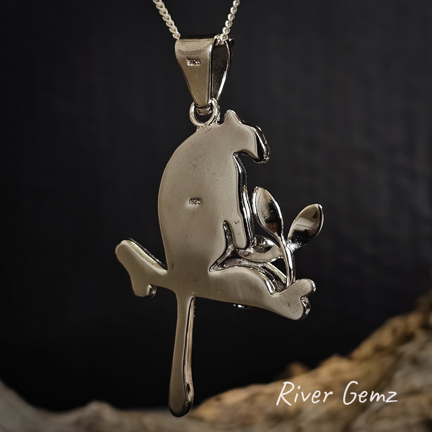 Back view of pendant displaying the 925 stamp for silver on a dark background, featuring the brand 'River Gemz'.