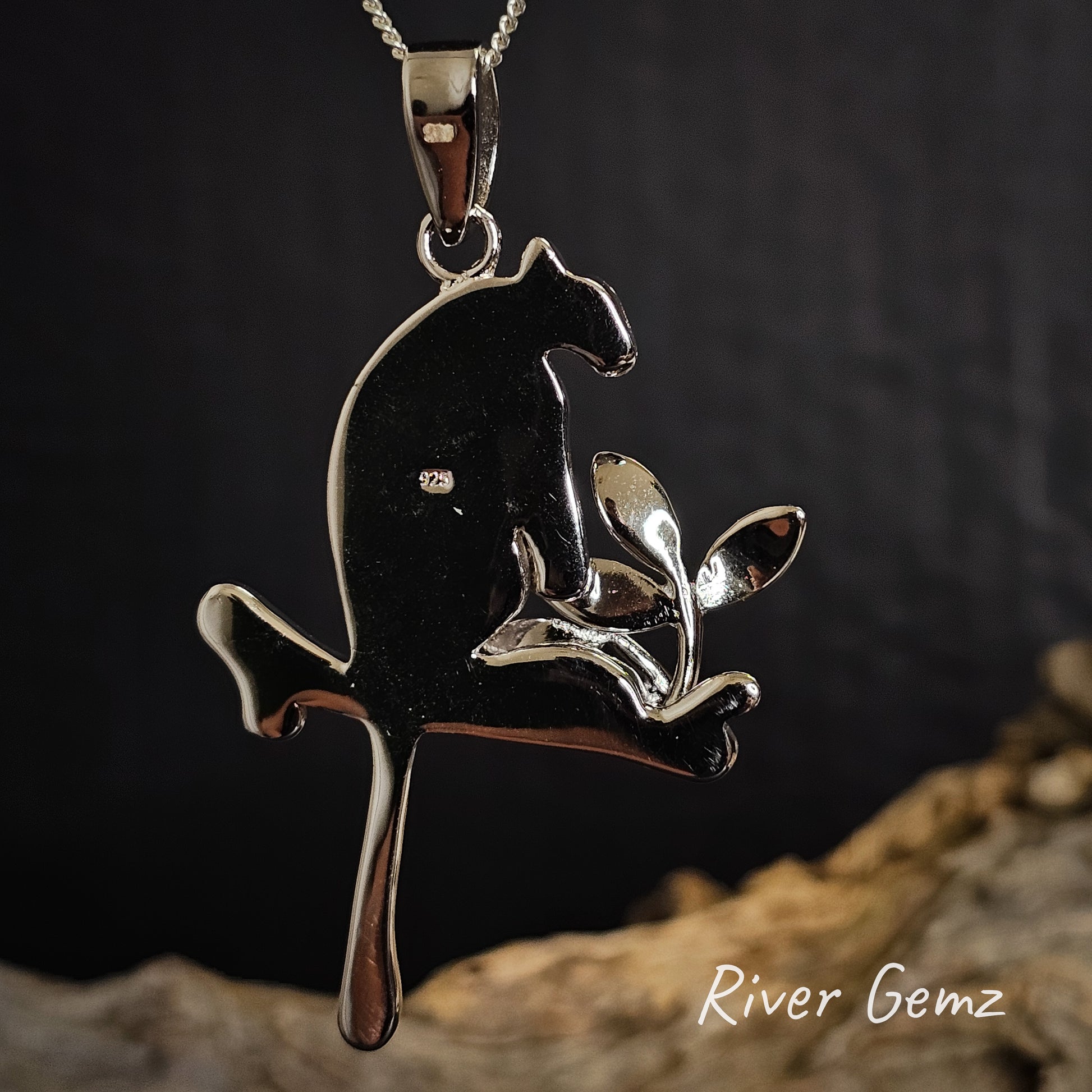 Back of pendant shows the 925 stamp to reflect sterling silver on a dark background with 'River Gemz' branding.