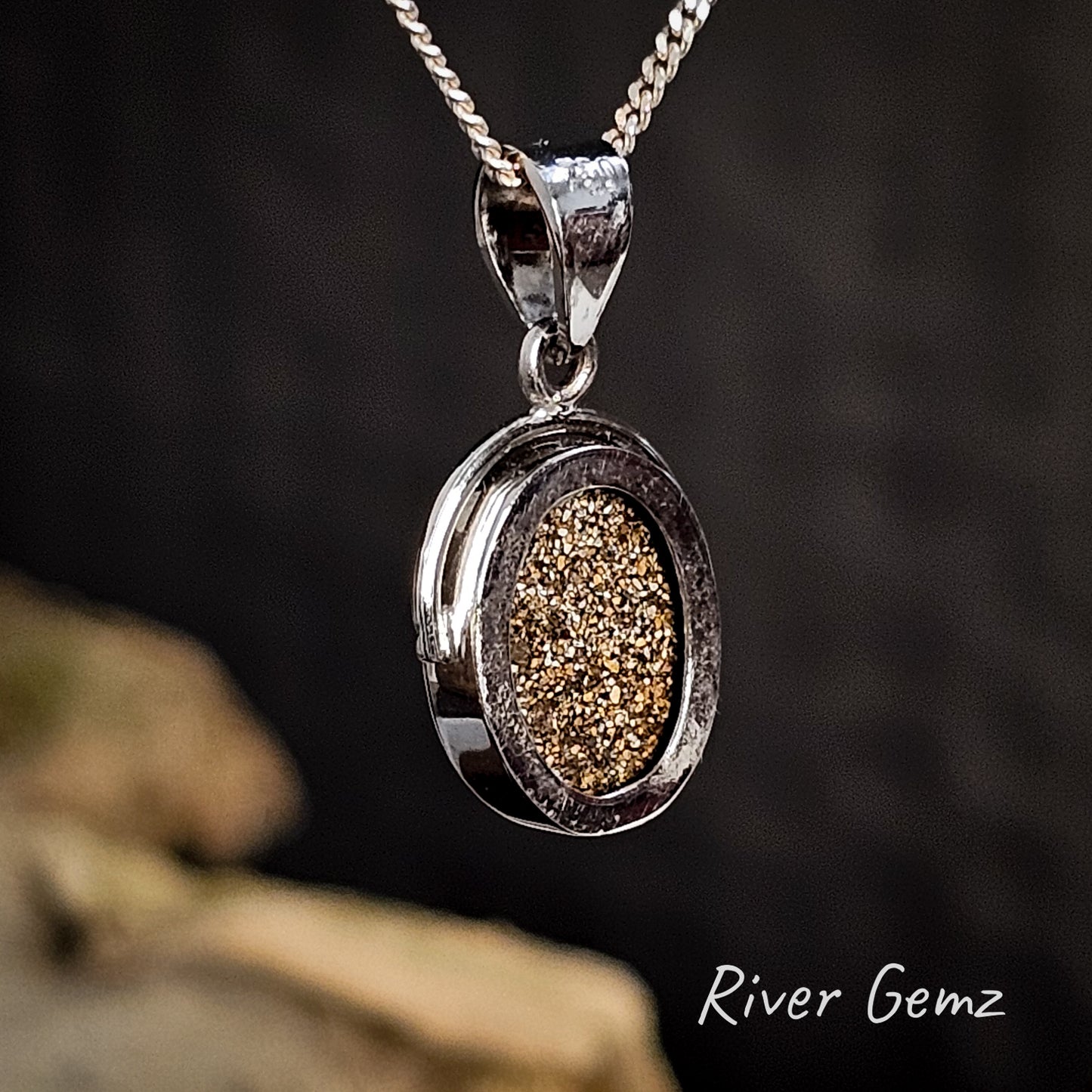 Back of the gold pendant shows the ironstone matrix of the included boulder opal on a dark background, featuring 'River Gemz' branding.
