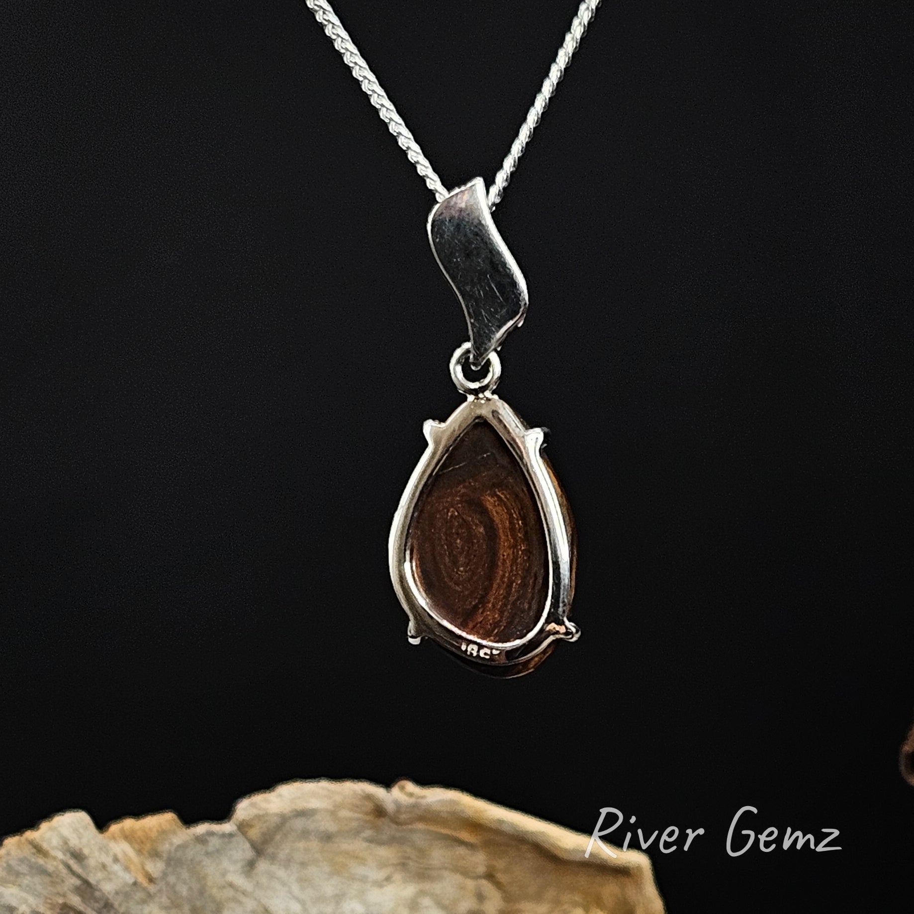 Rear view of necklace showing the ironstone matrix of the boulder opal.