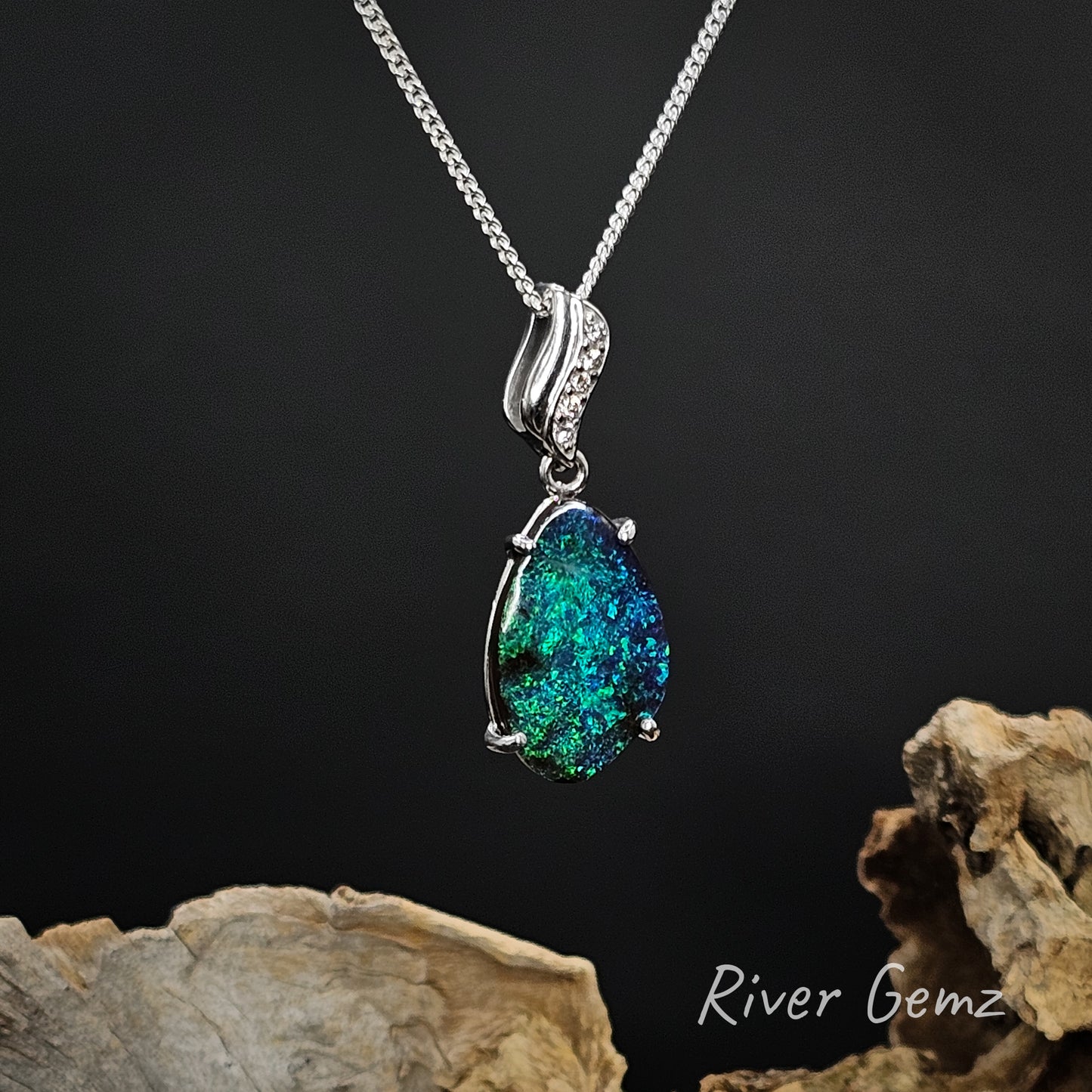 Opal pendant necklace on a dark background with 'River Gemz' branding.