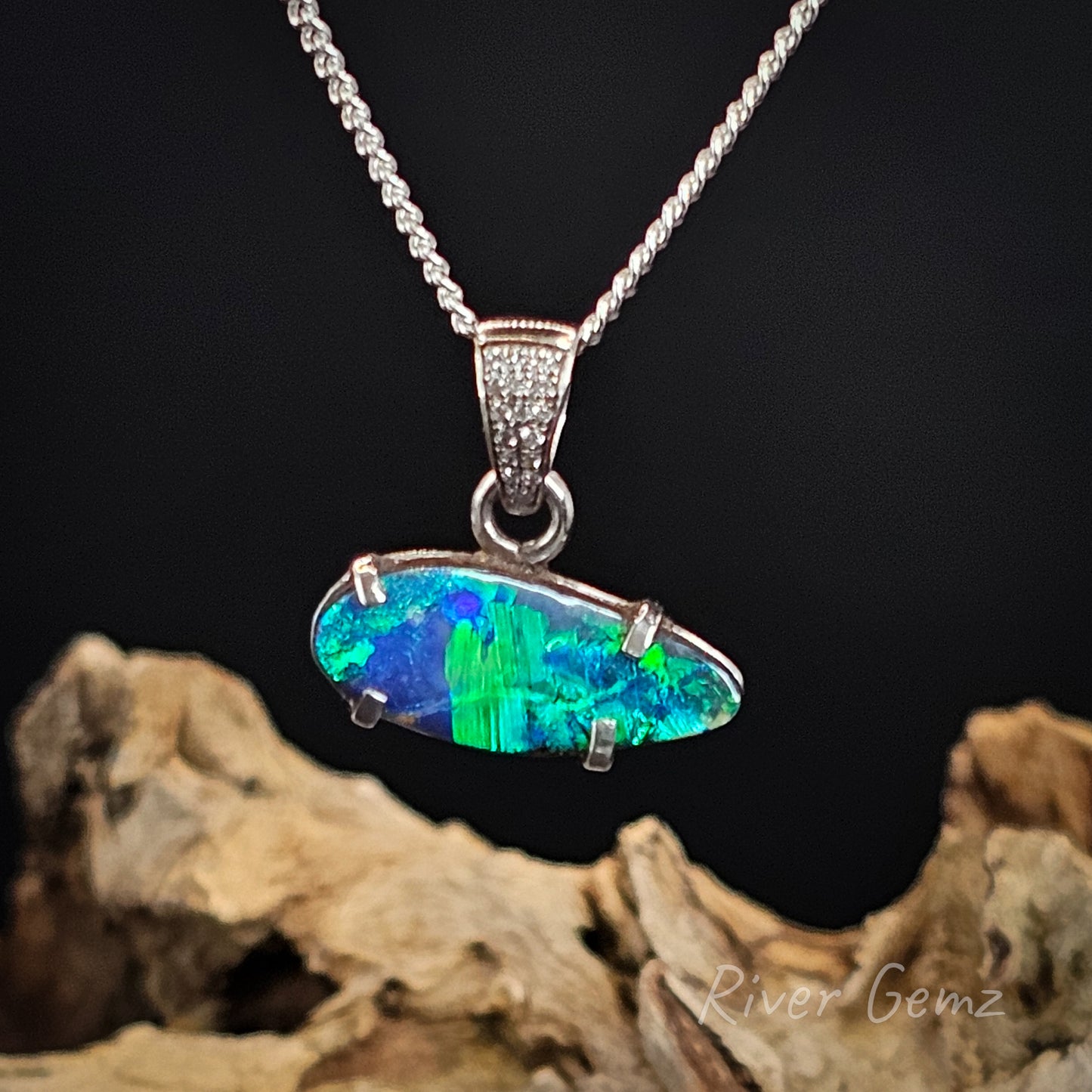 Opal pendant necklace on a dark background with 'River Gemz' branding.