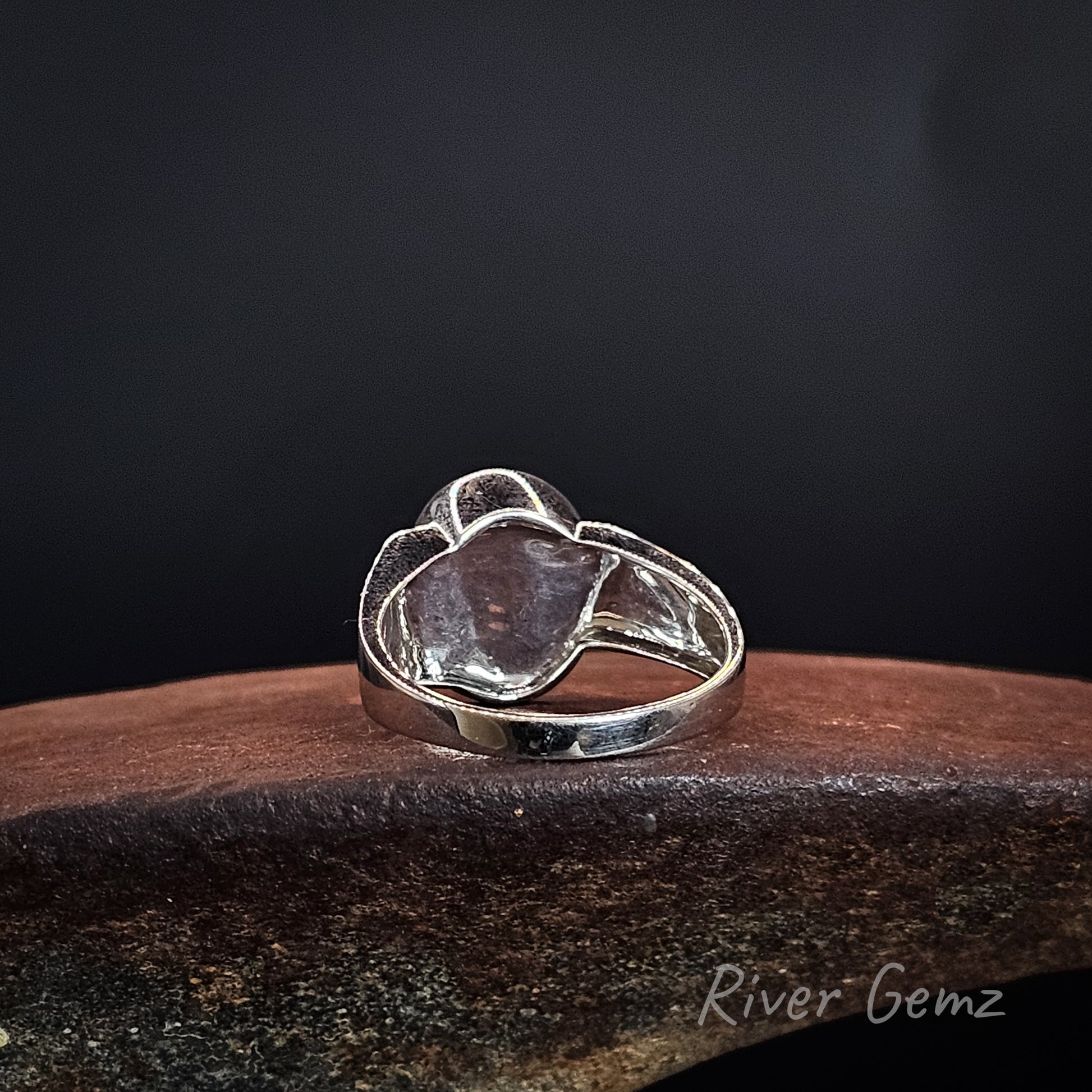 Rear view showing the full silver backing behind the opal.