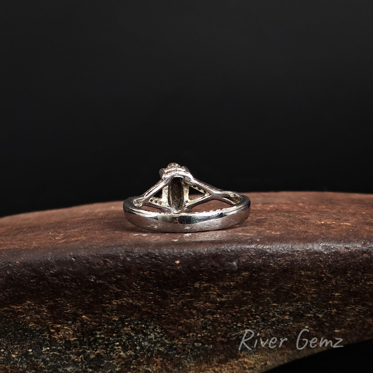 Rear view of the ring showing the dark brown base tone of the inserted boulder opal.
