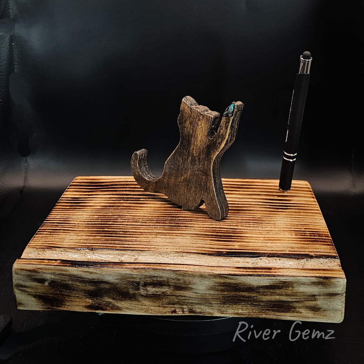 Brown Burmese type cat and pen on a torched wooden base.