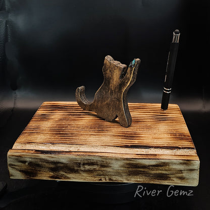 Brown Burmese type cat and pen on a torched wooden base.