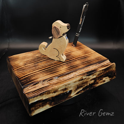 Wooden dog on a torched pine base which includes a stylus.